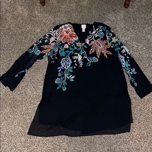 Floral designed black long sleeve blouse.